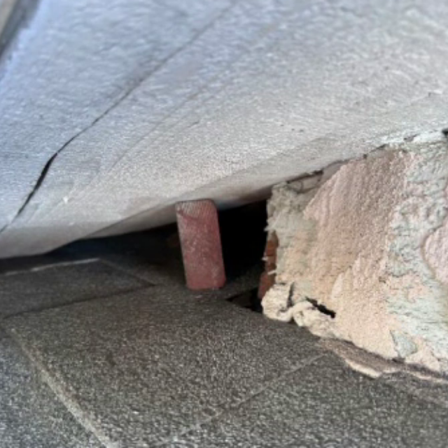 Open roofline gap between shingles and soffit or wall where rodents could enter
